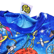 A close-up look of the collar of a blue t-shirt with a printed art design of many Sabahan animals, galaxy and ocean