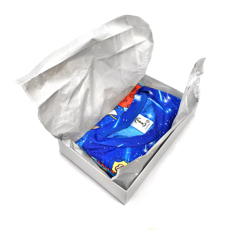 A packaging box of a blue t-shirt with a printed art design of many Sabahan animals, galaxy and ocean